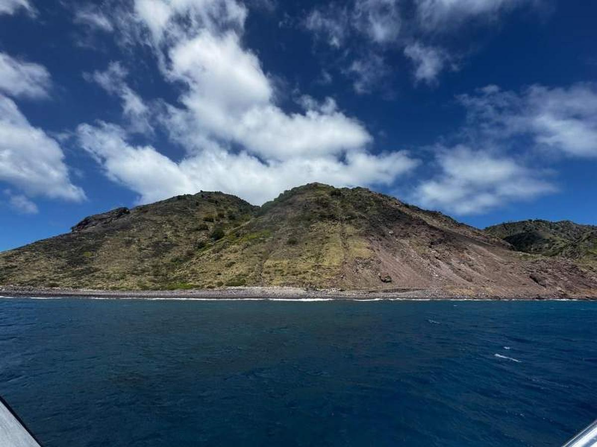  Gliding across crystal-clear waters offers a whole new perspective of Saba from the sea. Photo credit: Emily Molina 