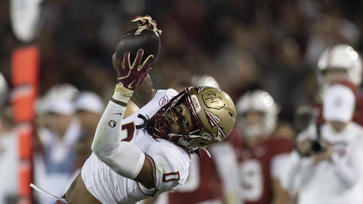  Oct 18, 2025; Stanford, California, USA; Florida State Seminoles defensive back Earl Little Jr. (0) intercepts the ball during the first quarter against the Stanford Cardinal at Stanford Stadium. Mandatory Credit: Stan Szeto-Imagn Images | Stan Szeto-Imagn Images 