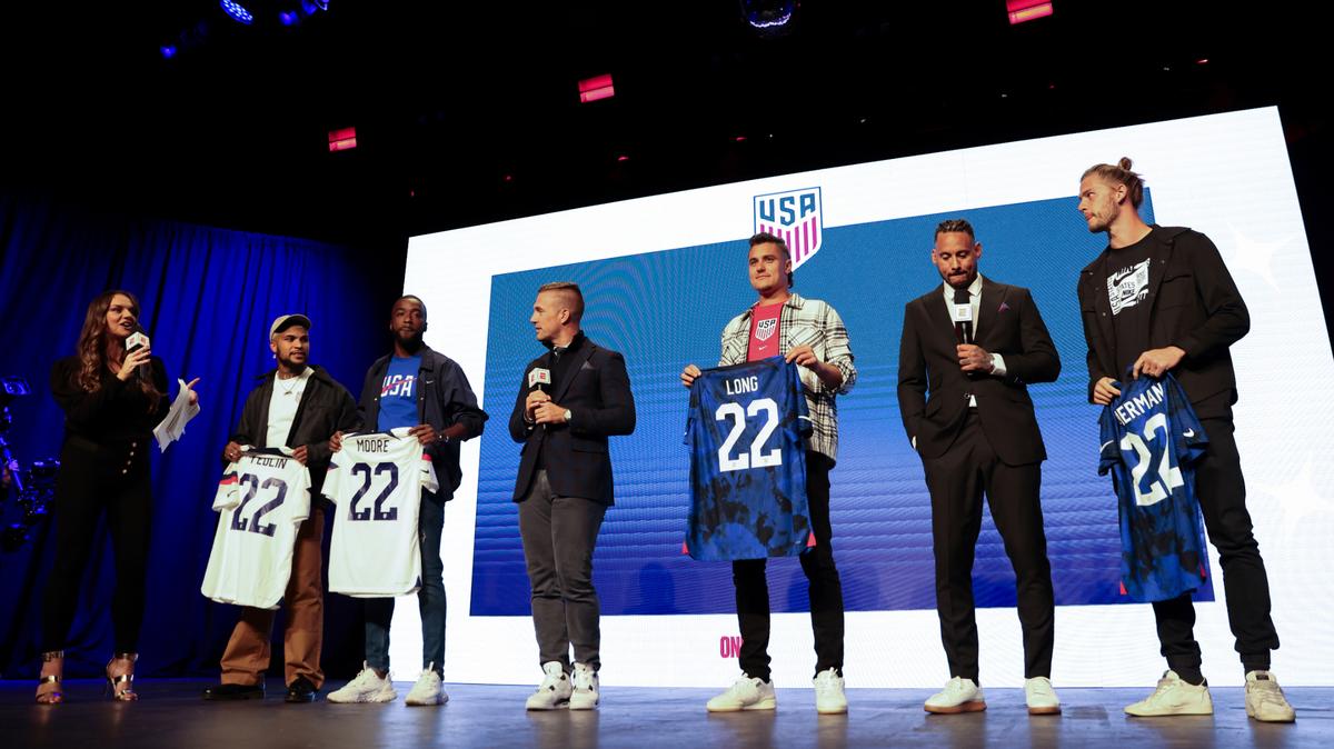 United States soccer players DeAndre Yedlin, Shaq Moore, Aaron Long and Walker Zimmerman hold up jerseys, Wednesday, Nov. 9, 2022, in New York, after being introduced announced as defenders on the U.S. men’s national soccer roster for the upcoming World Cup in Qatar.