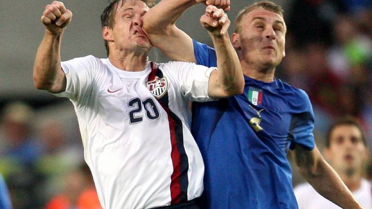  Daniele De Rossi (right) rearranged Brian McBride's features in the 2006 World Cup. | Wade Jackson/Icon SMI/Icon Sport Media/Getty Images 