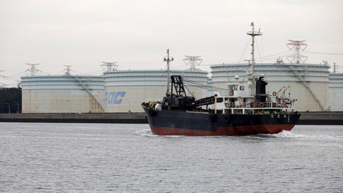 A ship sails before large-scale strategic crude oil reserve tanks of Fuji Oil Company (FOC) at the Sodegaura Refinery in Sodegaura, Chiba Prefecture, Tokyo Bay, Japan, 06 April 2026. Photo by FRANCK ROBICHON / EPA