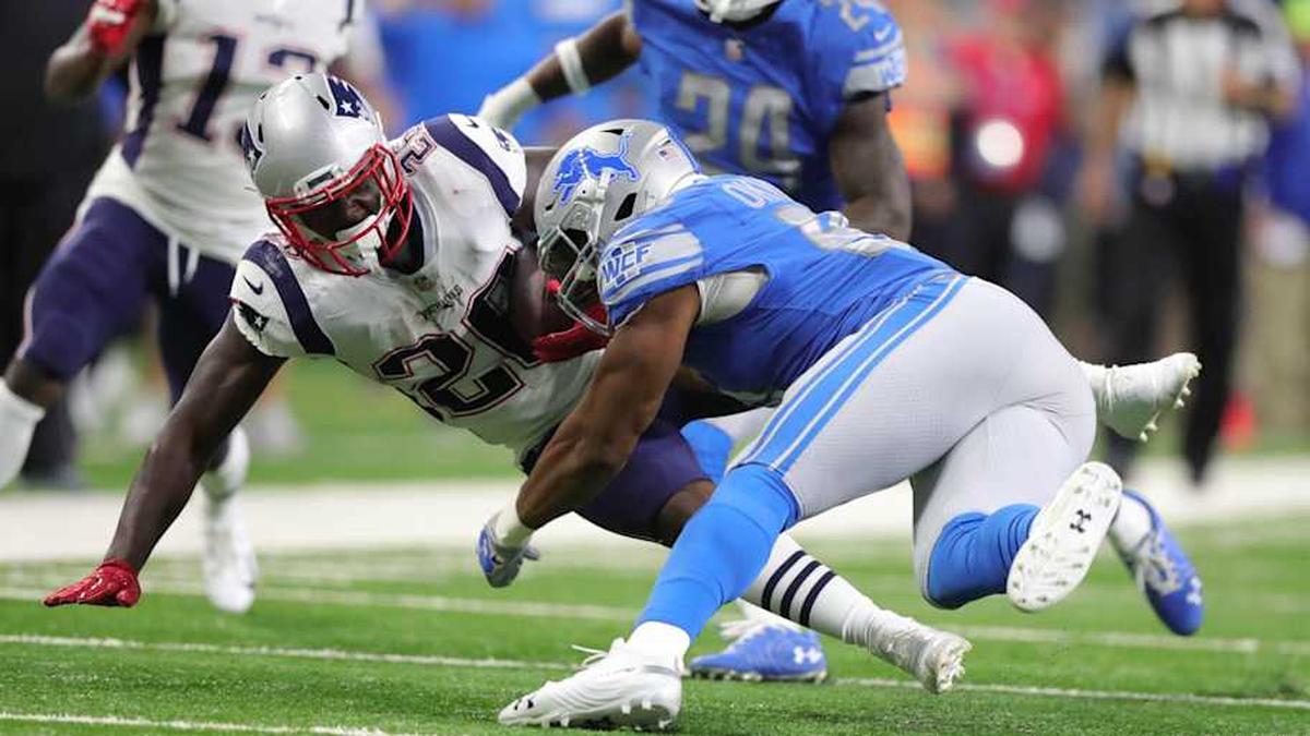  Detroit Lions safety Glover Quin tackles New England Patriots running back Sony Michel during the first quarter Sunday, Sept. 23, 2018 at Ford Field. Glover Quin, Sony Michel | Kirthmon F. Dozier, Detroit Free Press 