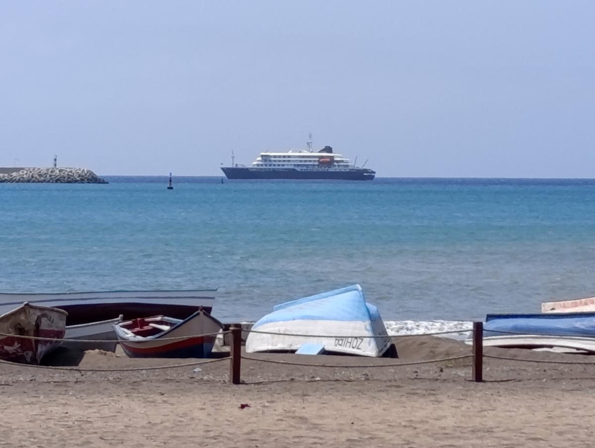 Cruise ship MV Hondius docks off Cape Verde port, as passengers were not allowed off the ship, while health authorities investigated suspected cases of hantavirus aboard the vessel, in Praia Port, Cape Verde, May 4, 2026. Picture taken with a mobile phone. REUTERS/Stringer     TPX IMAGES OF THE DAY