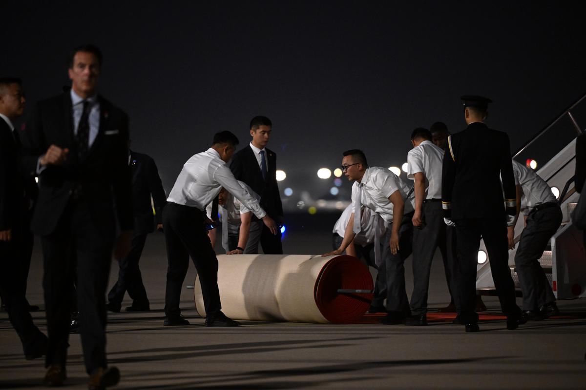 A red carpet is laid down in preparation for the arrival of President Donald Trump at Beijing Capital International Airport in Beijing, China, on Wednesday, May 13, 2026. Trump is in China for a two-day summit with China's leader, Xi Jinping. (Kenny Holston/The New York Times)