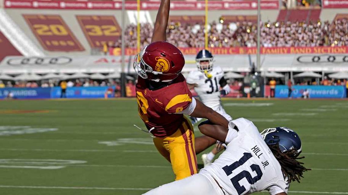  Sep 6, 2025; Los Angeles, California, USA; USC Trojans wide receiver Ja'Kobi Lane (8) makes a one handed catch for a touchdown as he is defended by Georgia Southern Eagles defensive back Tracy Hill Jr. (12) during the first quarter at United Airlines Field at Los Angeles Memorial Coliseum. Mandatory Credit: Jayne Kamin-Oncea-Imagn Images | Jayne Kamin-Oncea-Imagn Images 