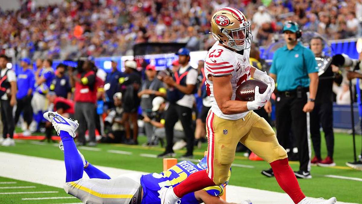 Oct 2, 2025; Inglewood, California, USA; San Francisco 49ers running back Christian McCaffrey (23) rushes the ball for a touchdown against the Los Angeles Rams during the first half at SoFi Stadium. Mandatory Credit: Gary A. Vasquez-Imagn Images | Gary A. Vasquez-Imagn Images 