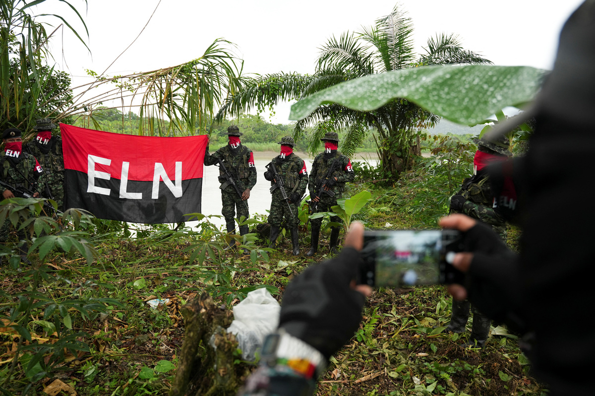 Rebels from Colombia's National Liberation Army (ELN) pose for a photograph, in the Choco department, Colombia, June 12, 2026. REUTERS/Jair Coll