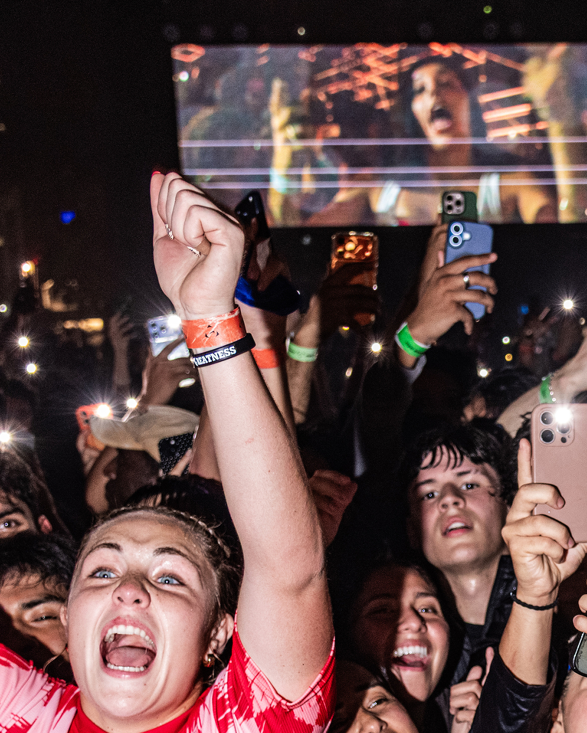 People cheer during performances with rapper Travis Scott at a Nike Toma soccer event in New York on June 27, 2026. As World Cup matches take place across the United States, Nike and Adidas, the two largest sportswear companies in the world, are spending millions of dollars in a duel over the future of soccer in America. (Emma Rose Milligan/The New York Times)