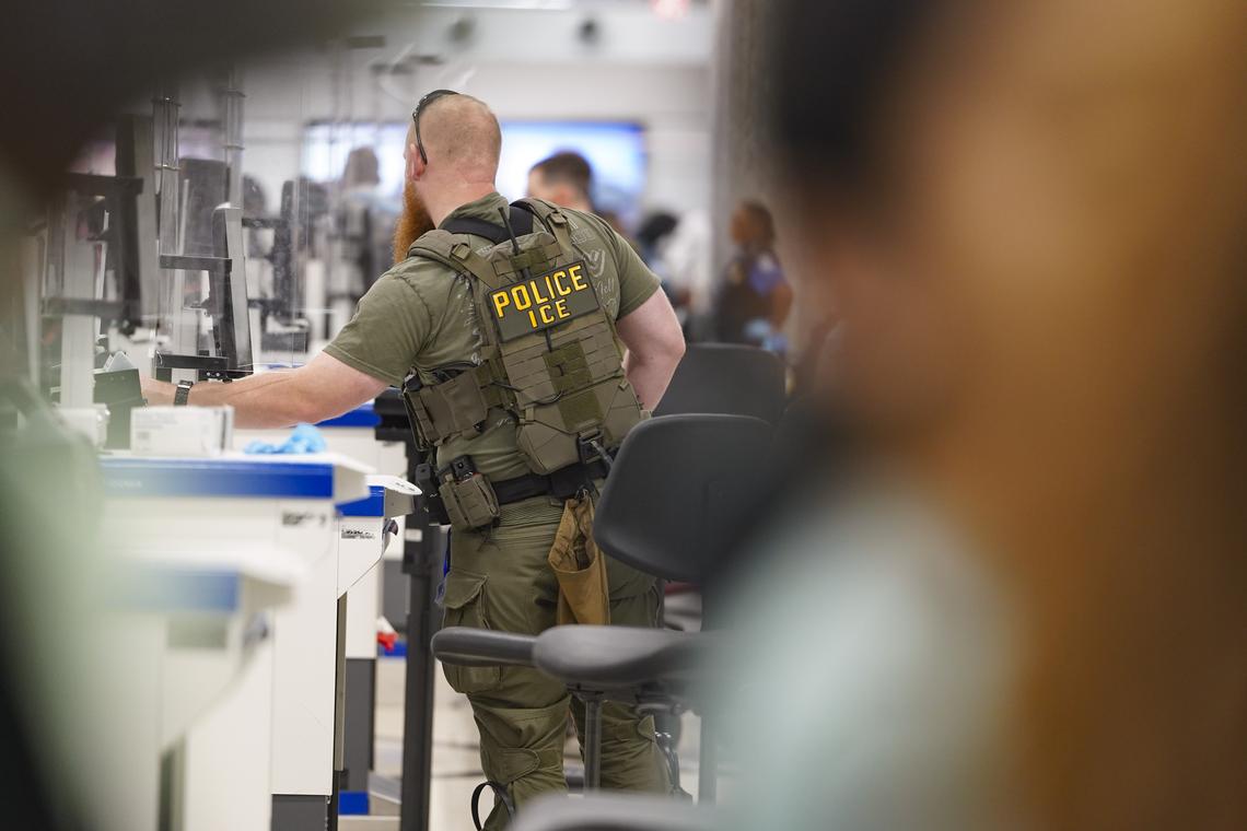  ICE agents check IDs at the TSA security checkpoint at Atlanta Hartsfield-Jackson International Airport on March 27, 2026. 