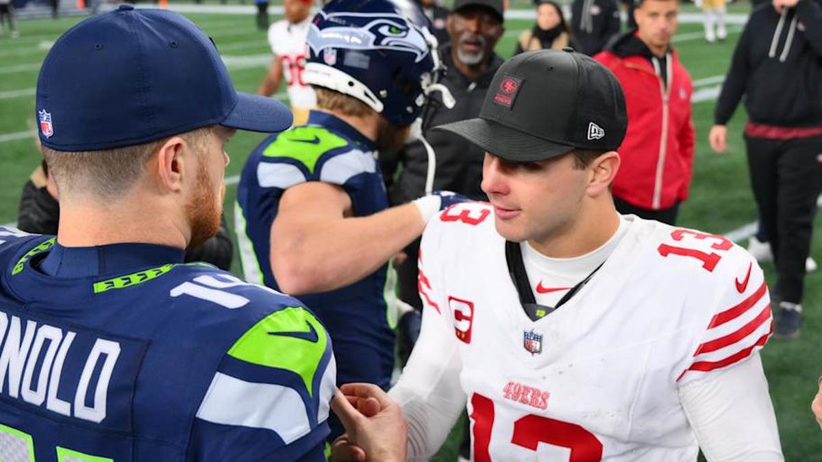  Jan 17, 2026; Seattle, WA, USA; Seattle Seahawks quarterback Sam Darnold (14) and San Francisco 49ers quarterback Brock Purdy (13) shake hands following an NFC Divisional Round game at Lumen Field. Mandatory Credit: Steven Bisig-Imagn Images | Steven Bisig-Imagn Images 
