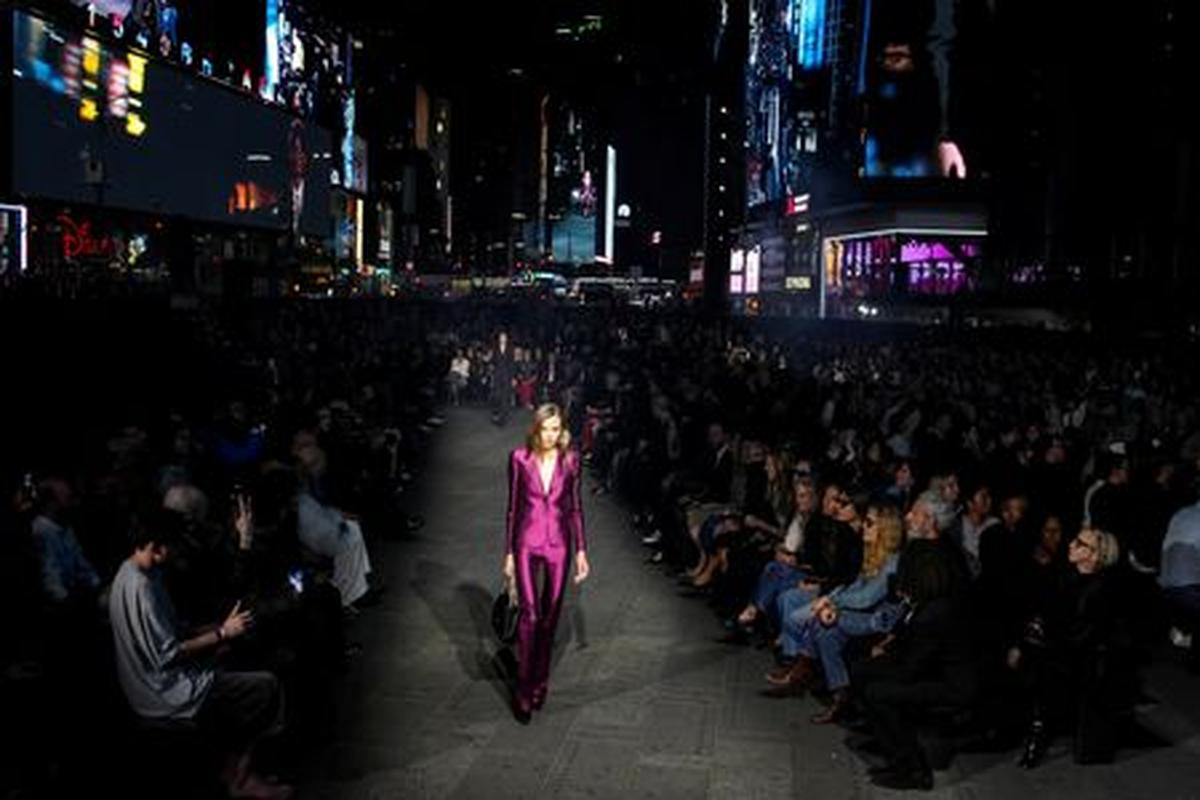 A model presents a creation from the Gucci Cruise 2027 collection at Times Square in New York City, U.S., May 16, 2026. REUTERS/Eduardo Munoz