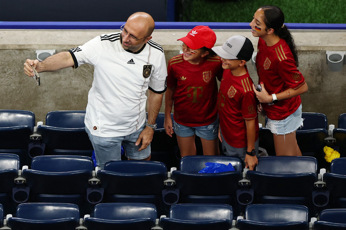 Soccer Football - FIFA World Cup 2026 - Group E - Germany v Curacao - Houston Stadium, Houston, Texas, U.S. - June 14, 2026 Germany fans take a selfie photograph inside the stadium before the match REUTERS/Pedro Nunes