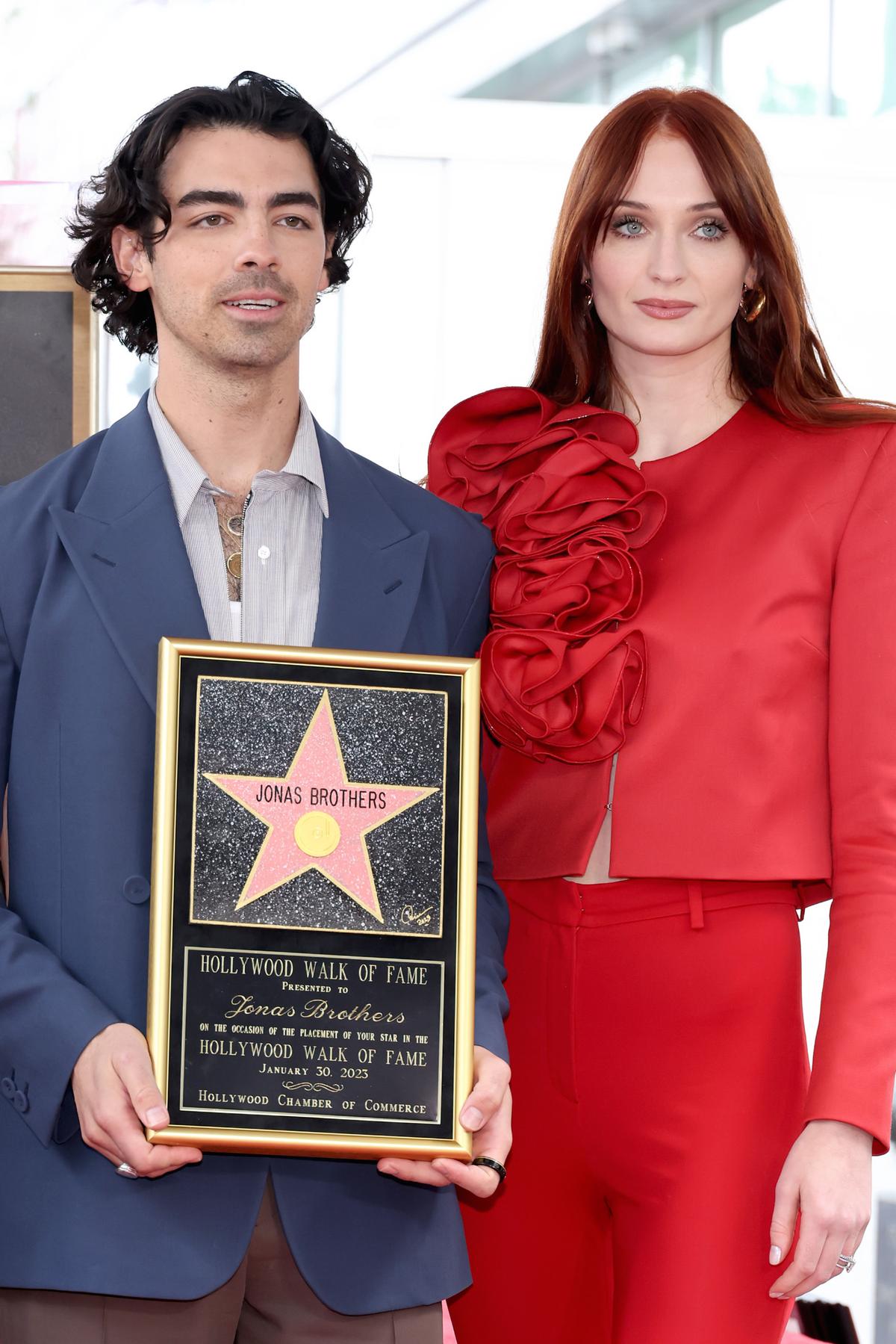 September 2023 Sophie filed a lawsuit against Joe for the "immediate return" of their two daughters, Willa and Delphine, to England. The court documents claimed Joe had the passports of both girls and refused to hand them over. Amy Sussman / Getty Images