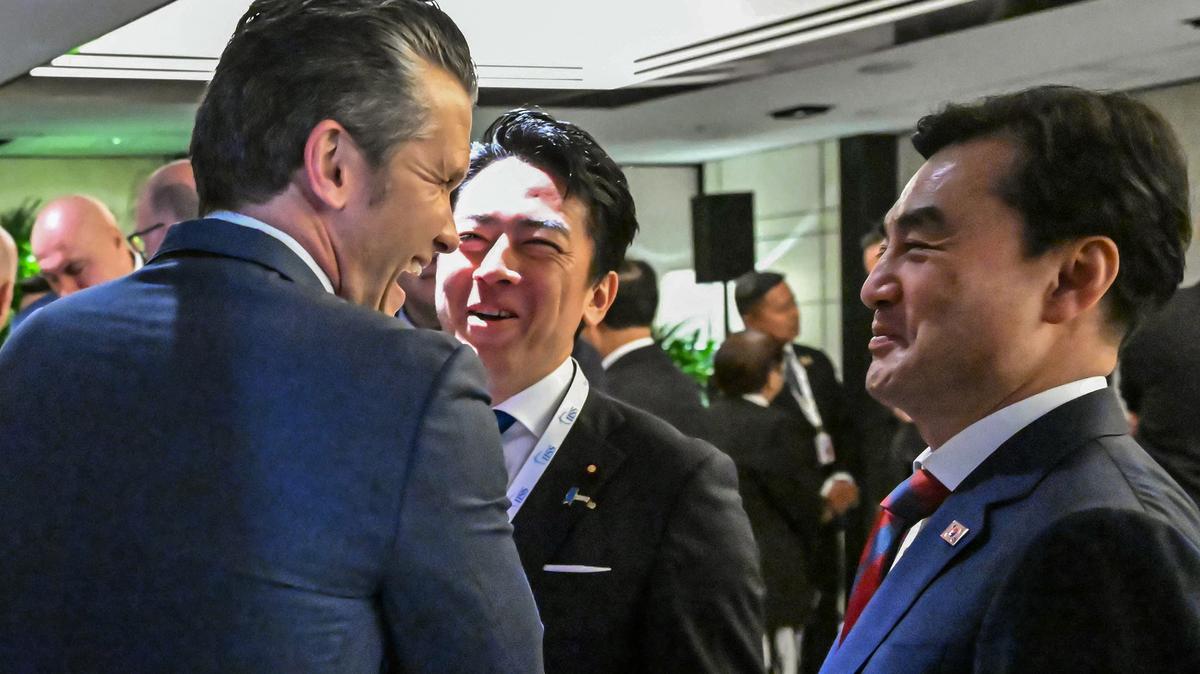 U.S. Secretary of Defence Pete Hegseth, left, speaks with South Korea's Minister of National Defense Ahn Gyu-back, right, and Japan's Defense Minister Shinjiro Koizumi as they arrive for a ministerial roundtable during the 23rd Shangri-La Dialogue summit in Singapore on Saturday, May 30, 2026. (Mohd Rasfan/AFP/Getty Images/TNS)