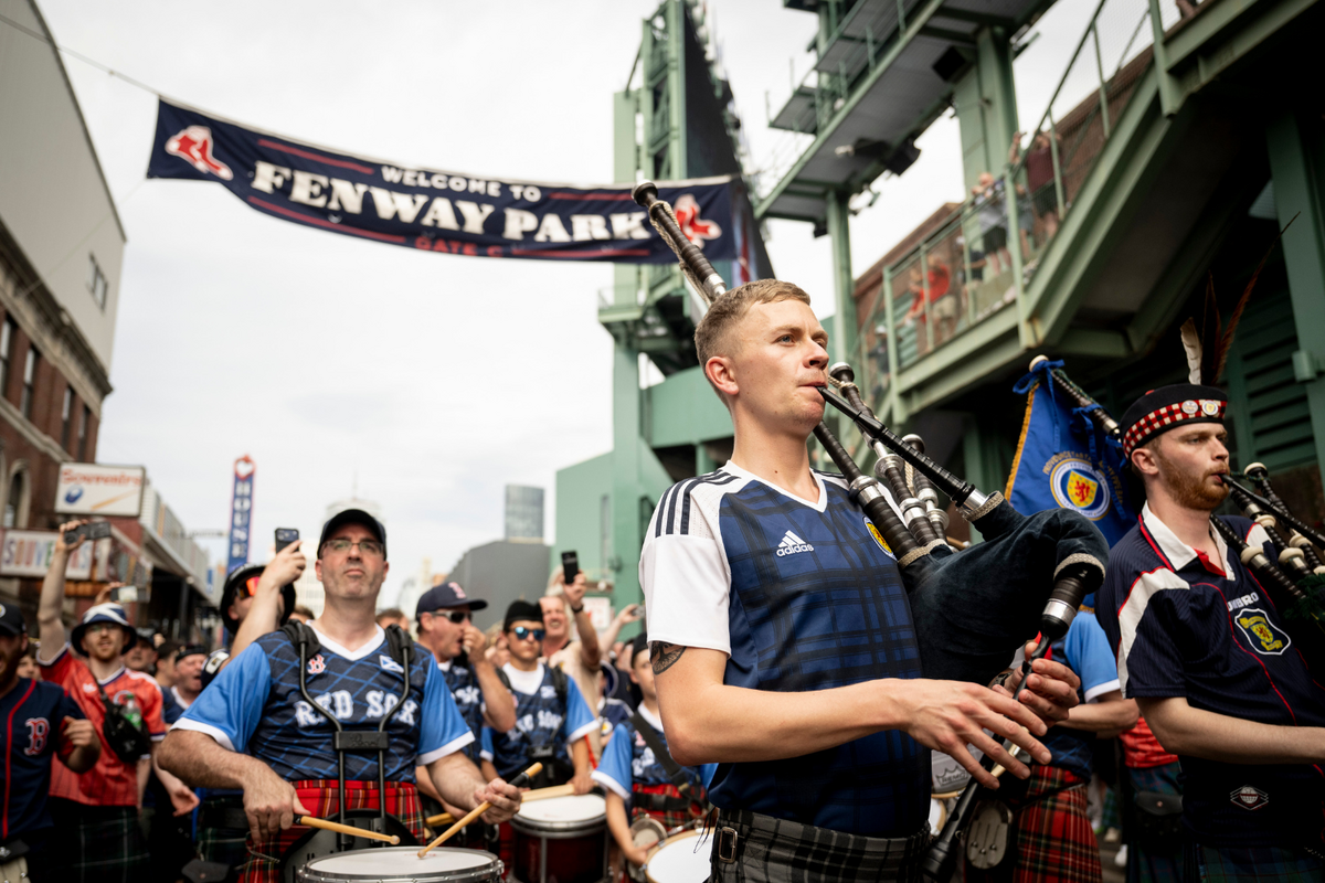 Members of Scotland’s “Tartan Army” march down Lansdowne Street to Fenway Park before a game between the Texas Rangers and the Boston Red Sox on June 14, 2026 in Boston, Massachusetts. 