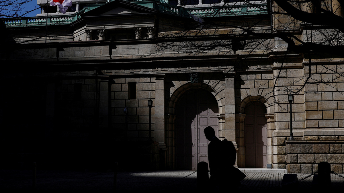 A man walks past the Bank of Japan building in Tokyo, Japan, March 18, 2024. REUTERS/Kim Kyung-Hoon