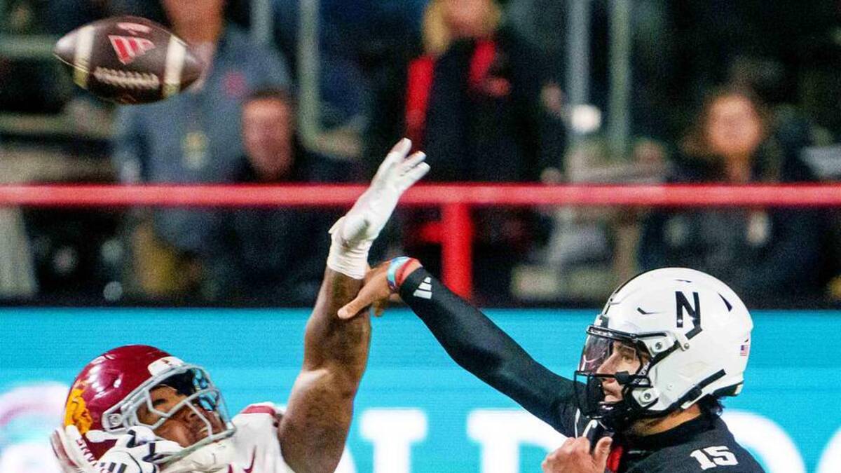  Nov 1, 2025; Lincoln, Nebraska, USA; Nebraska Cornhuskers quarterback Dylan Raiola (15) passes against Southern California Trojans defensive tackle Devan Thompkins (8) during the second quarter at Memorial Stadium. Mandatory Credit: Dylan Widger-Imagn Images | Dylan Widger-Imagn Images 