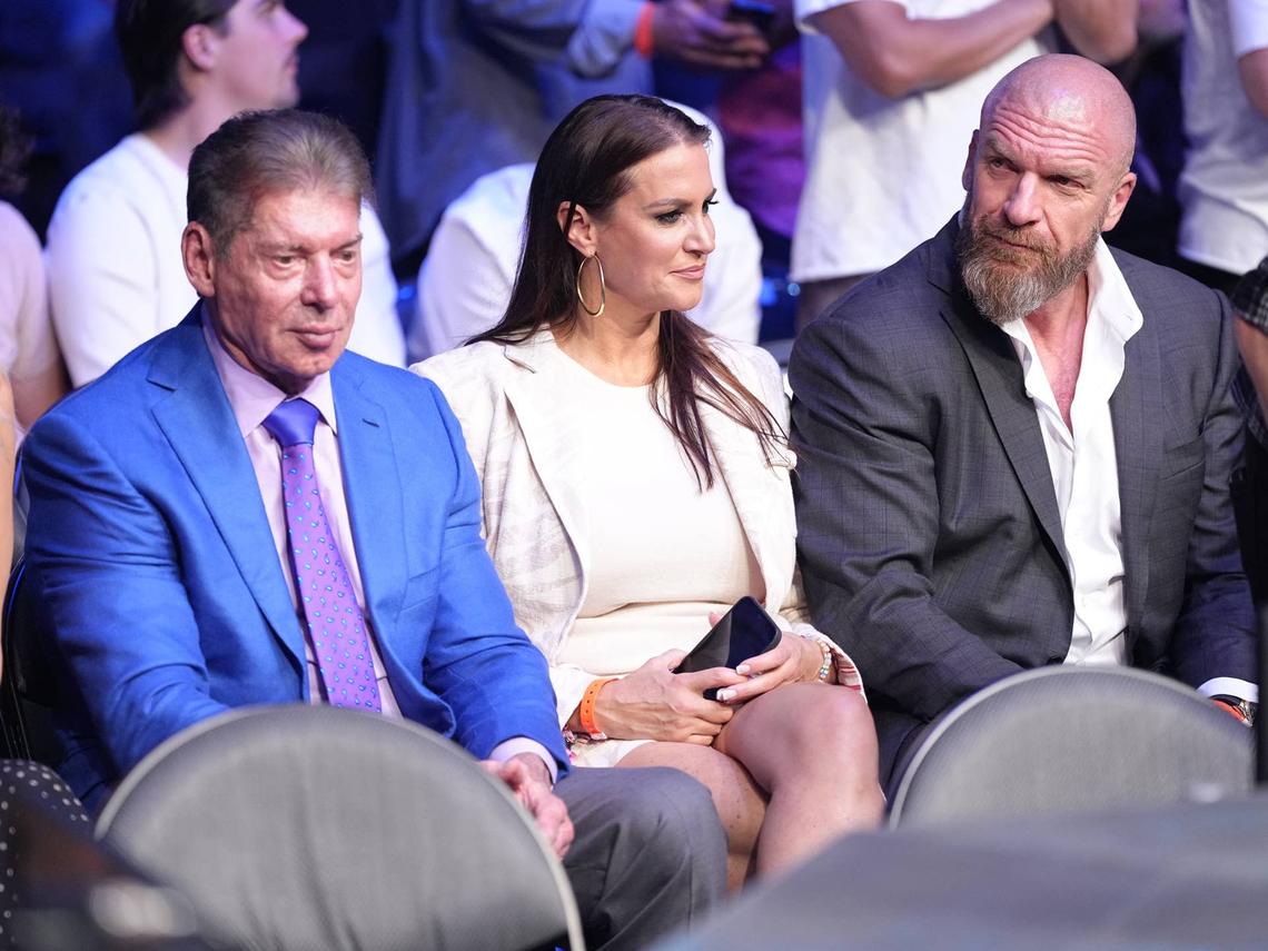  Vince McMahon sits alongside Stephanie McMahon and Paul "Triple H" Levesque. Getty Images