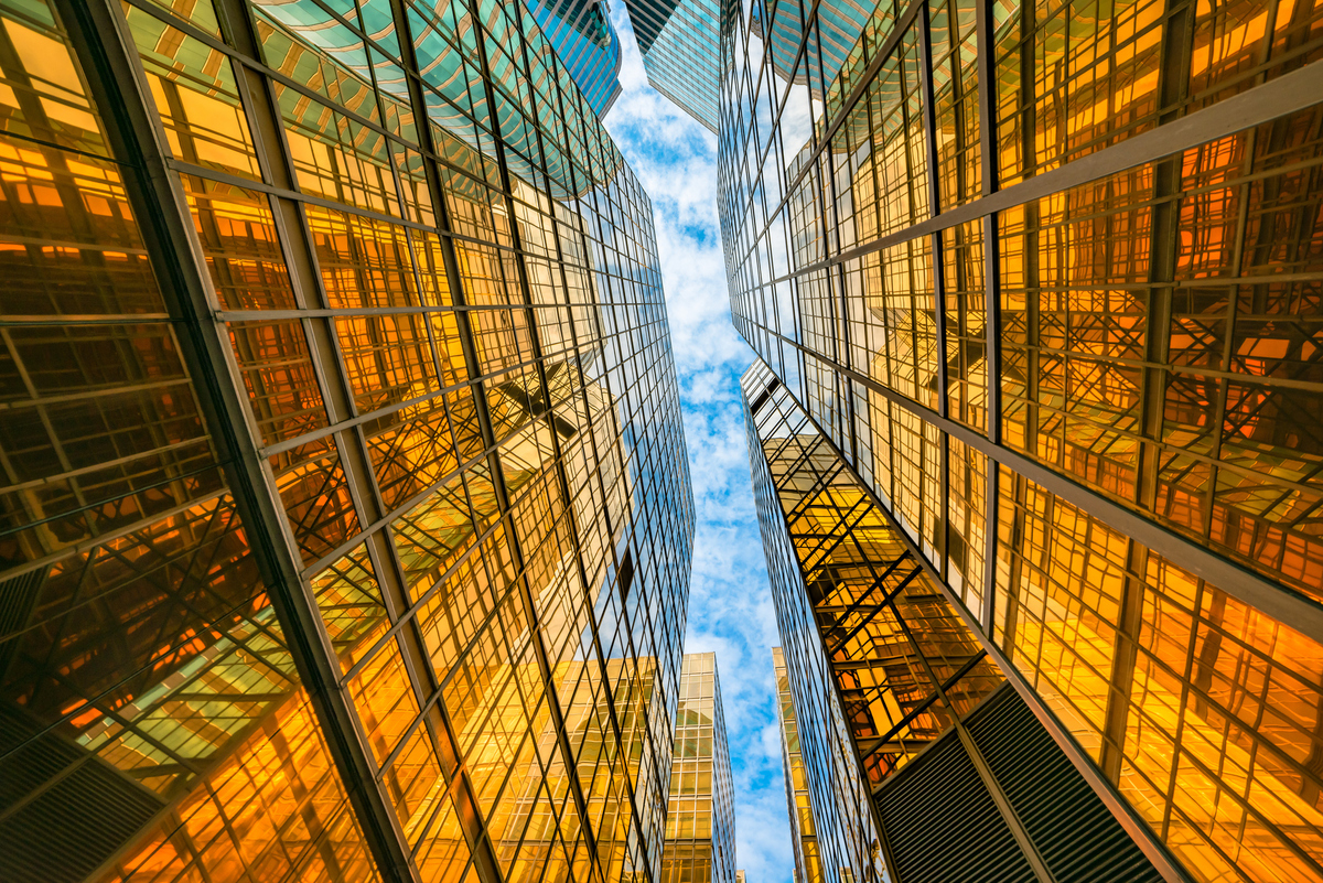  A view looking up between two skyscrapers in Hong Kong. 