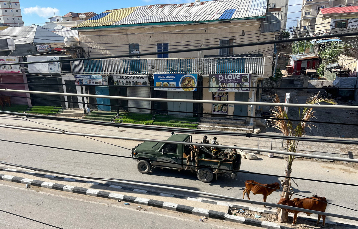 A truck carrying Somali security forces drives on a road ahead of a planned protest against Somalia's President Hassan Sheikh Mohamud over his decision to remain in office after his term expired last month, in Mogadishu, Somalia, June 4, 2026. Picture taken with a mobile phone. REUTERS/Feisal Omar