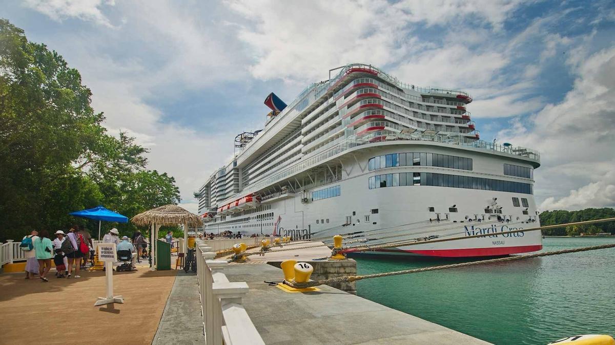  Some Carnival passengers like to use neck fans on hot days in Caribbean cruise ports. 