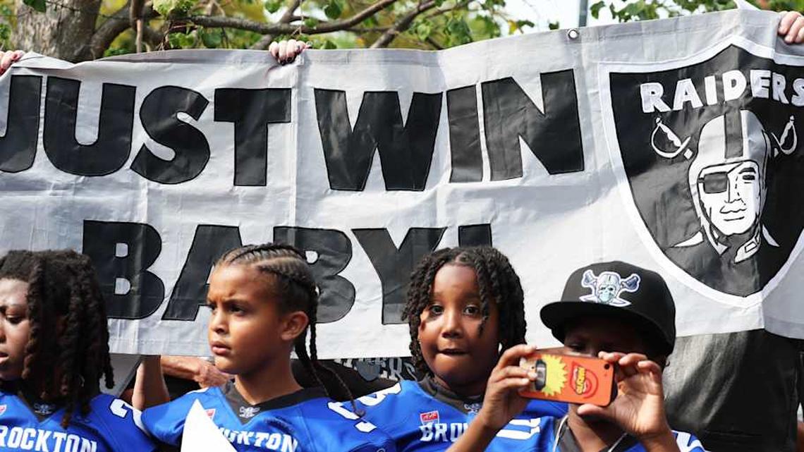  Raiders youth football players as the City of Brockton honored Brockton native and NFL legend Al Davis by unveiling a commemorative plaque behind City Hall on Saturday, Sept. 6, 2025. | Marc Vasconcellos/The Enterprise / USA TODAY NETWORK via Imagn Images 