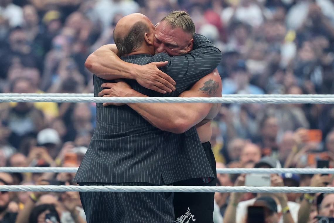 Brock Lesnar embraces Paul Heyman following his last match at WrestleMania 42.Getty Images