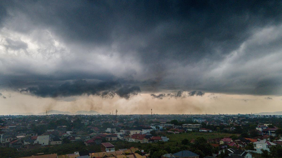 Rain clouds form over residential houses at Darul Imarah on the outskirts of Banda Aceh, Indonesia, on April 20, 2026.