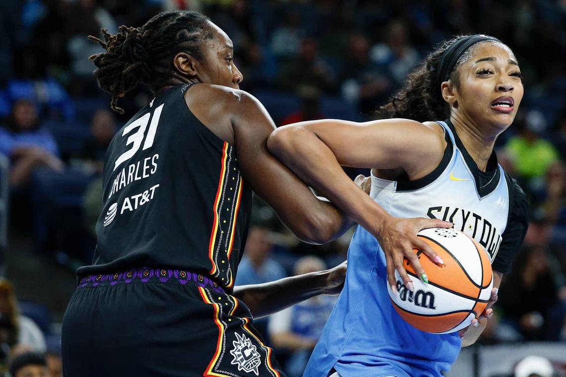  Chicago Sky forward Angel Reese (5) drives to the basket against Connecticut Sun center Tina Charles (31). Kamil Krzaczynski-Imagn Images