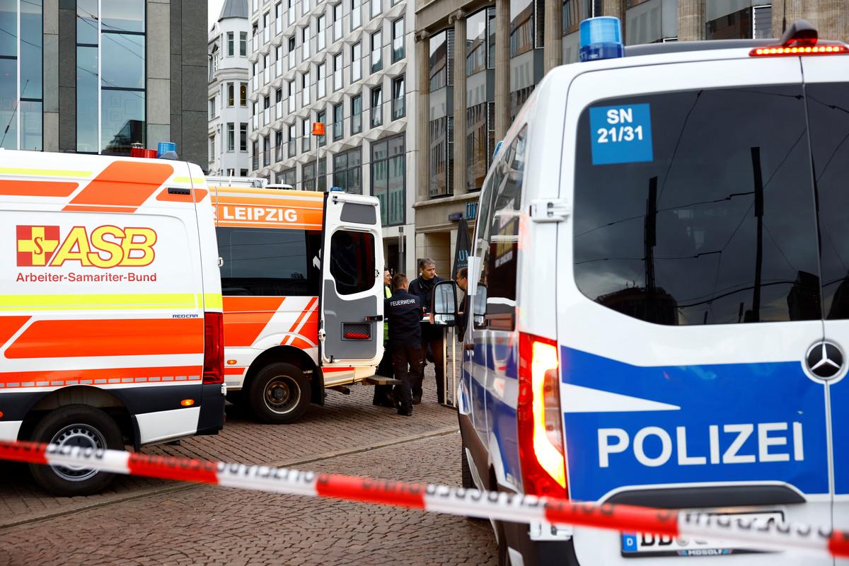 Emergency and security personnel work at a site where a car drove into a group of people, in Leipzig, Germany, May 4, 2026.  REUTERS/Axel Schmidt