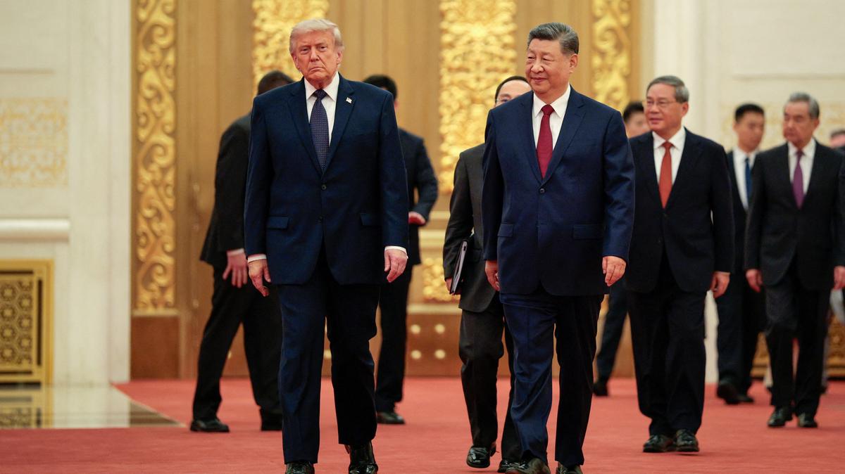 U.S. President Donald Trump and Chinese President Xi Jinping arrive to attend a state banquet at the Great Hall of the People in Beijing, China, May 14, 2026. REUTERS/Evan Vucci