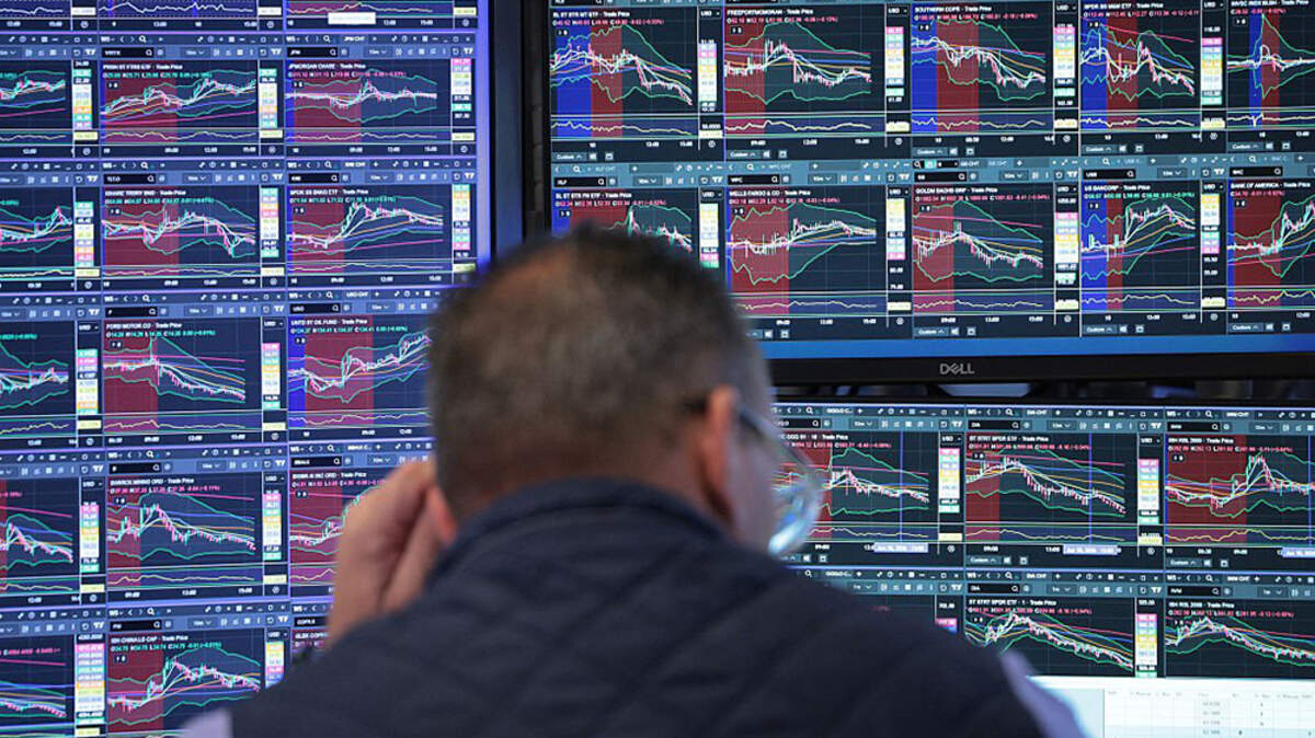 Traders work on the floor of the New York Stock Exchange during afternoon trading on Wednesday. The major U.S. stock indexes ended more than 1% lower on Wednesday, with chipmaker shares extending recent declines and with renewed tensions between the U.S. and Iran adding to investor uncertainty.