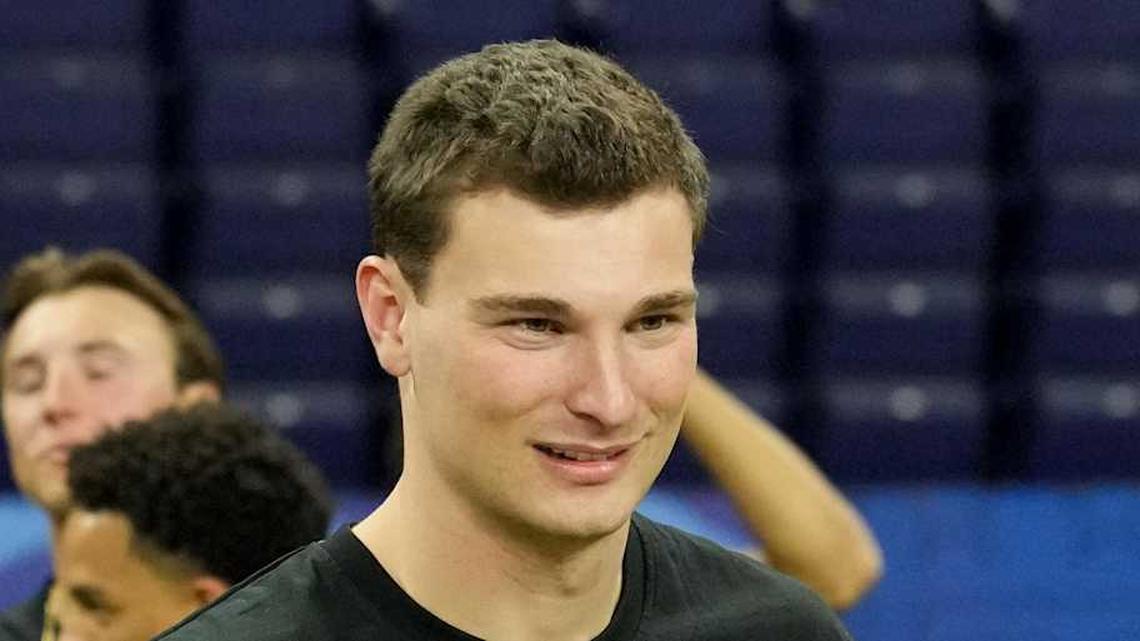  Feb 28, 2026; Indianapolis, IN, USA; Indiana quarterback Fernando Mendoza (QB11) greets Alabama quarterback Ty Simpson (QB17) during the NFL Scouting Combine at Lucas Oil Stadium. Mandatory Credit: Kirby Lee-Imagn Images | Kirby Lee-Imagn Images 