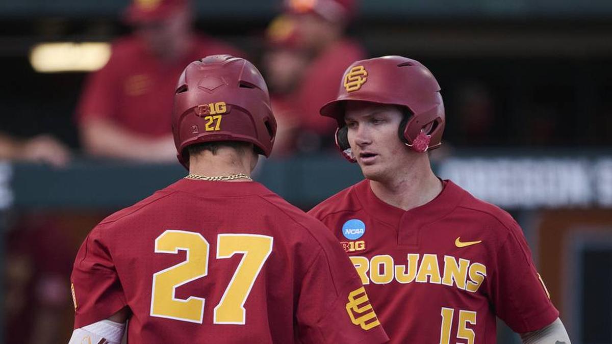  May 31, 2025; Corvallis, OR, USA; USC infielder Ethan Hedges (15) encourage infielder Bryce Martin-Grudzielanek (27) during the fifth inning after hitting his second home run of the game at the NCAA Corvallis Regional at Goss Stadium. Mandatory Credit: Troy Wayrynen-Imagn Images | Troy Wayrynen-Imagn Images 