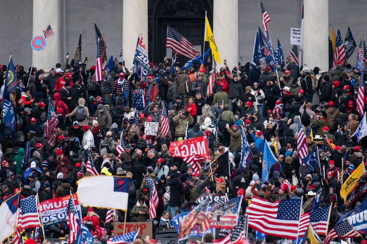  Donald Trump-aligned rioters take over the steps of the Capitol on Jan. 6, 2021, as Congress works to certify the Electoral College votes. Bill Clark/CQ-Roll Call, Inc via Getty Images 