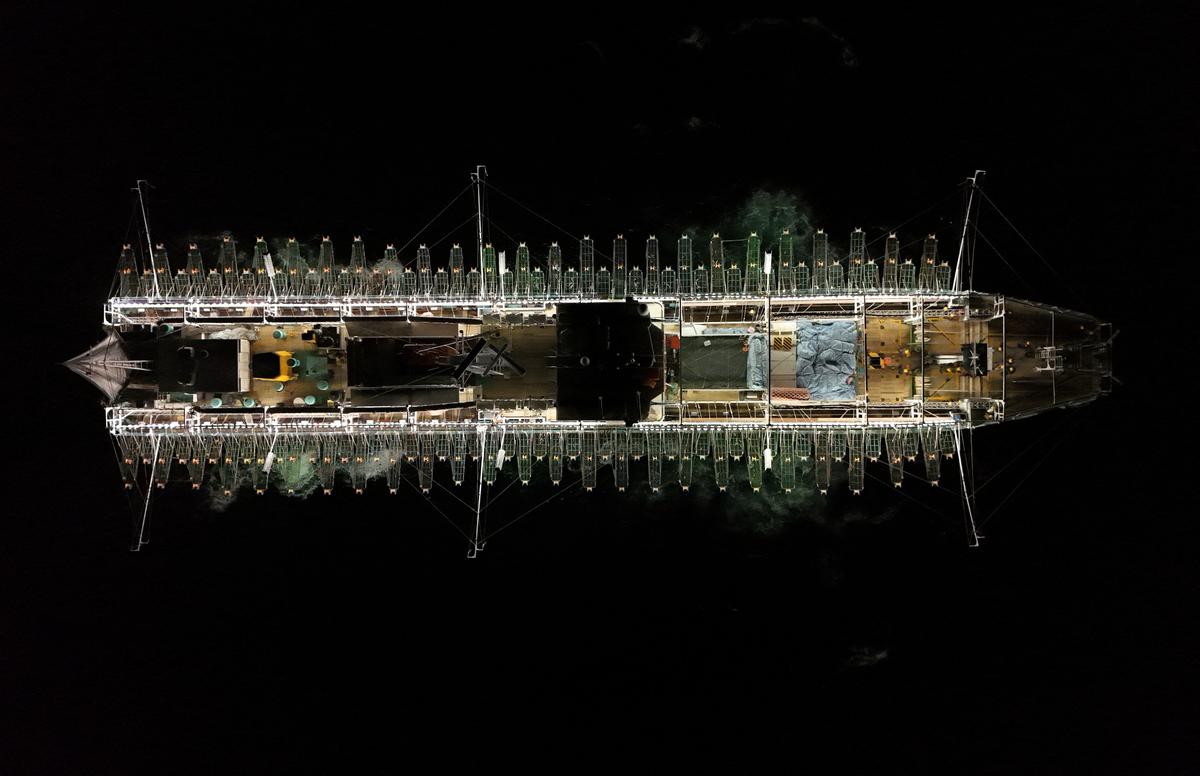 A drone view shows a squid jigger vessel fishing outside Argentina's exclusive economic zone, where foreign fishing vessels, mostly Chinese, operate just beyond the boundary, in the South Atlantic Ocean off the coast of Argentina, January 18, 2026. REUTERS/Agustin Marcarian