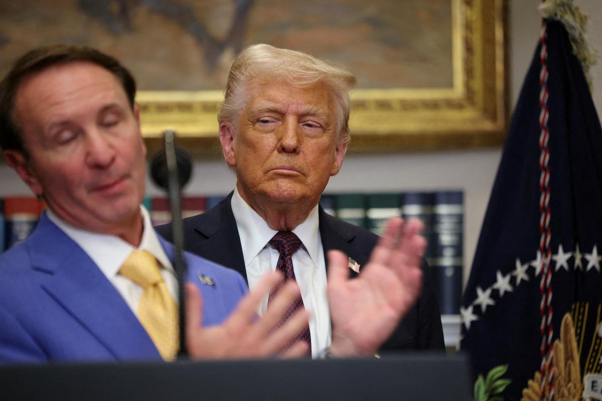 FILE PHOTO: U.S. President Donald Trump listens as Governor of Louisiana Jeff Landry delivers remarks, in the Roosevelt Room at the White House, in Washington, D.C., U.S., March 24, 2025. REUTERS/Carlos Barria/File Photo