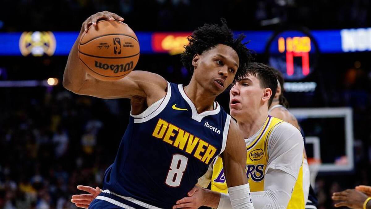  Jan 20, 2026; Denver, Colorado, USA; Denver Nuggets guard Peyton Watson (8) controls the ball under pressure from Los Angeles Lakers forward Jake LaRavia (12) in the first quarter at Ball Arena. Mandatory Credit: Isaiah J. Downing-Imagn Images | Isaiah J. Downing-Imagn Images 