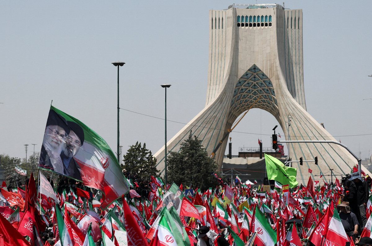 Mourners gather on the day of a funeral procession for Iran's late Supreme Leader Ayatollah Ali Khamenei, who was killed on February 28 in Israeli and U.S. airstrikes, in Tehran, Iran, July 6, 2026. REUTERS/Mohammed Salem