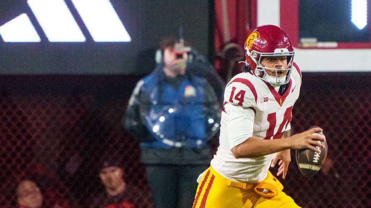  Nov 1, 2025; Lincoln, Nebraska, USA; Southern California Trojans quarterback Jayden Maiava (14) scrambles against the Nebraska Cornhuskers during the first quarter at Memorial Stadium. Mandatory Credit: Dylan Widger-Imagn Images | Dylan Widger-Imagn Images 