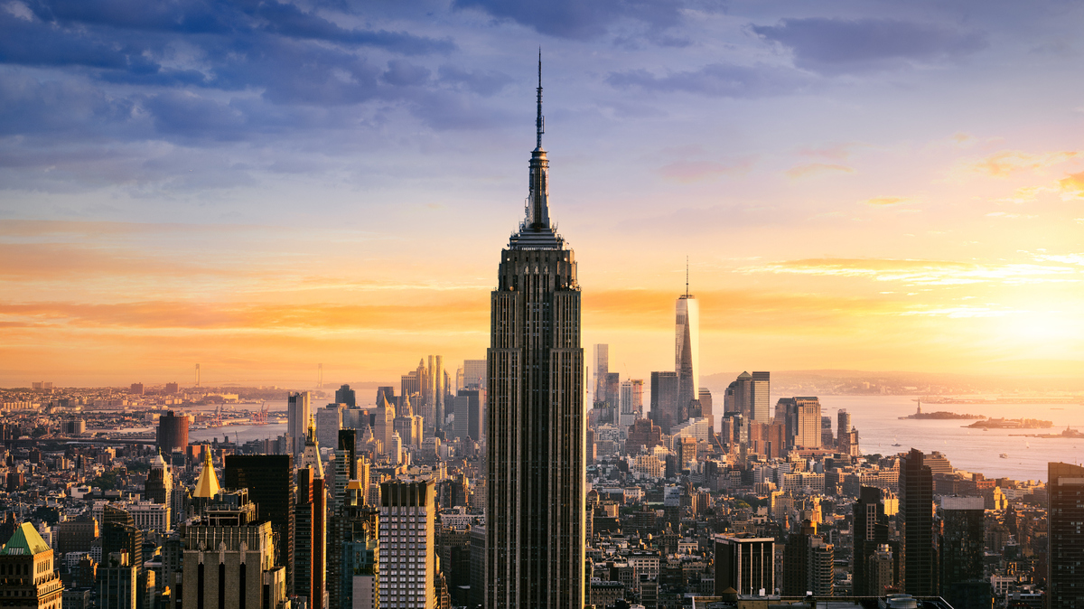 A view of the Empire State Building against the New York City skyline. 