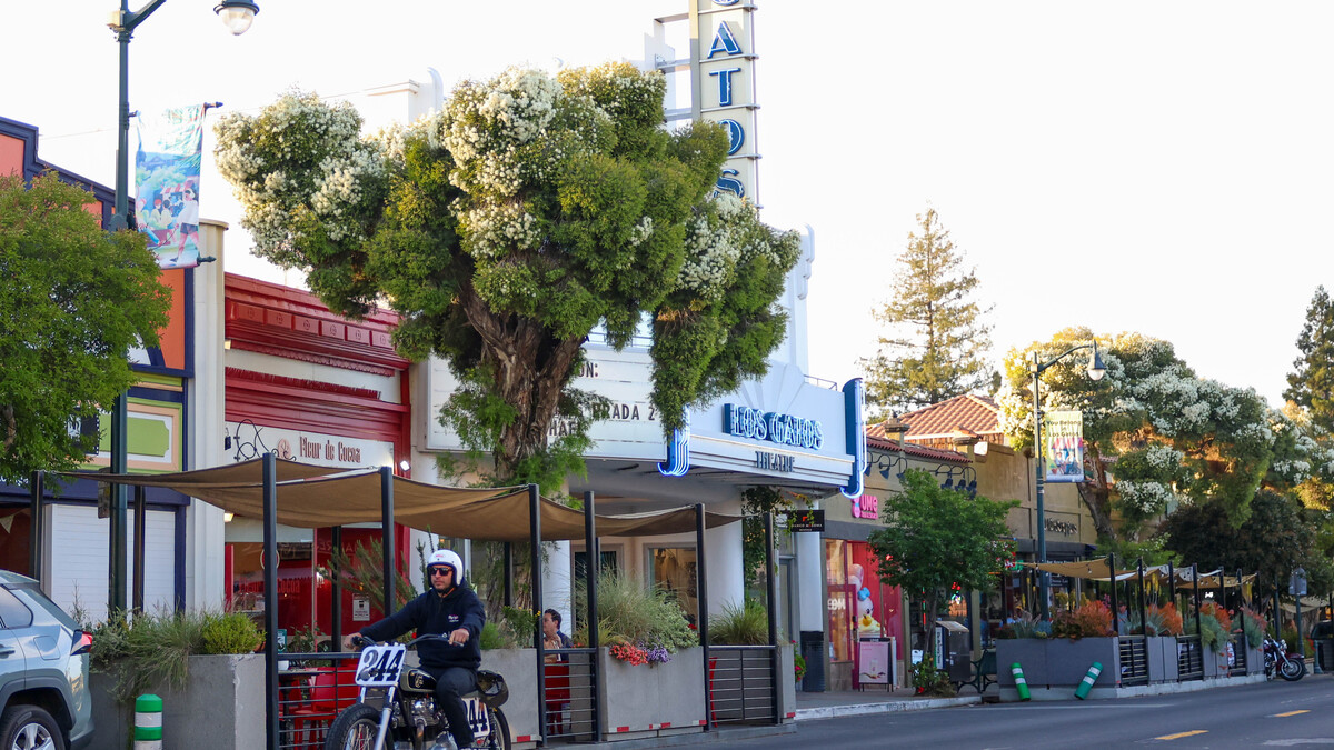 A person rides on a motorcycle through downtown Los Gatos on Friday, April 17, 2026.  (Shae Hammond/Bay Area News Group)