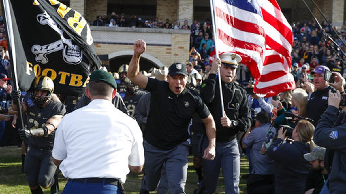 In this file photo, Army coach Jeff Monken, center, leads his team onto the field before the Armed Forces Bowl against Houston on Dec. 22, 2018, in Fort Worth. Army and Monken will be making another appearance in the bowl game, Dec. 22 against Missouri.