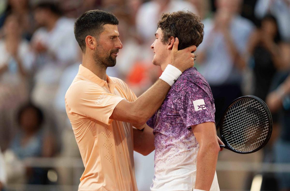  May 29, 2026; Paris, France; Joao Fonseca of Brazil and Novak Djokovic of Serbia at the net after their match on day six at Stade Roland Garros. Mandatory Credit: Susan Mullane-Imagn Images 