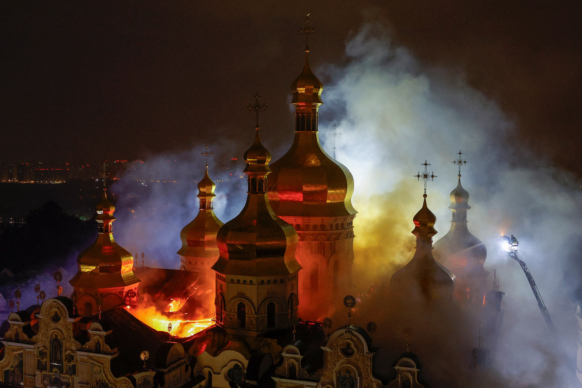 Firefighters work to extinguish a fire at the Dormition Cathedral of the Kyiv Pechersk Lavra, which was hit during Russian missile and drone strikes, amid Russia's attack on Ukraine, in Kyiv, Ukraine June 15, 2026. REUTERS/Valentyn Ogirenko