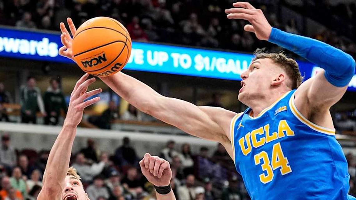  Michigan State center Carson Cooper (15) and UCLA forward Tyler Bilodeau (34) battle for the rebound during the first half of Big Ten tournament quarterfinal at United Center in Chicago on Friday, March 13, 2026. | Junfu Han / USA TODAY NETWORK via Imagn Images 