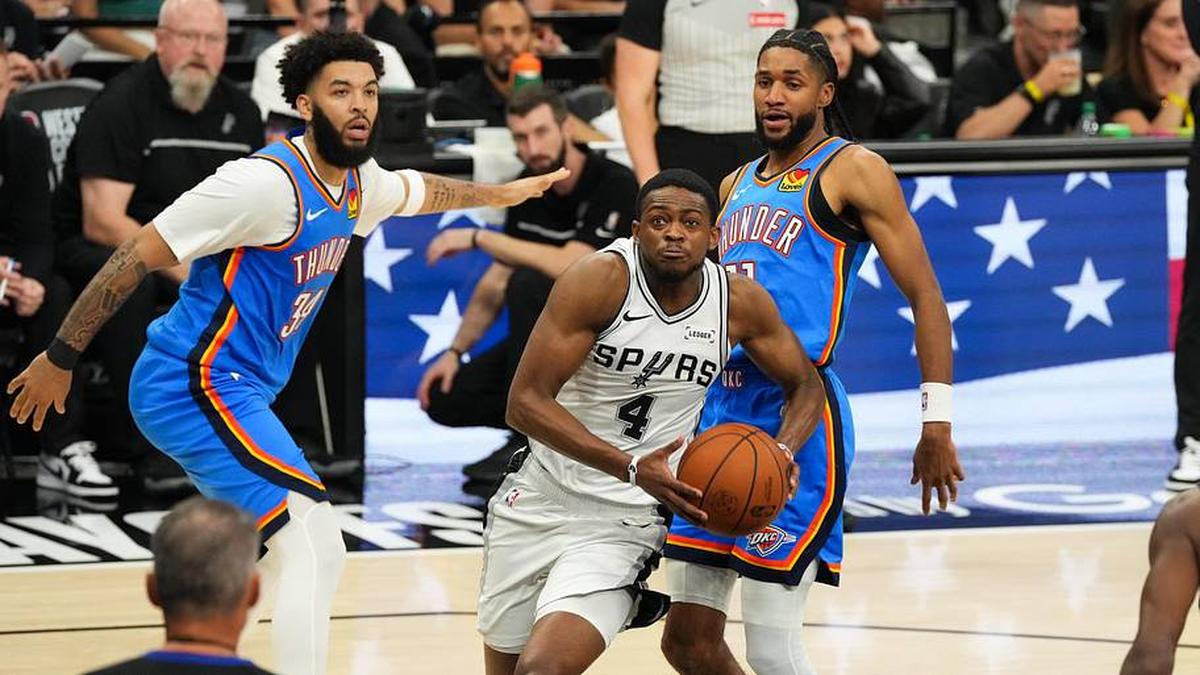  Spurs guard De'Aaron Fox drives the ball past Thunder guard Isaiah Joe in the fourth quarter of Game 4. | Scott Wachter-Imagn Images 