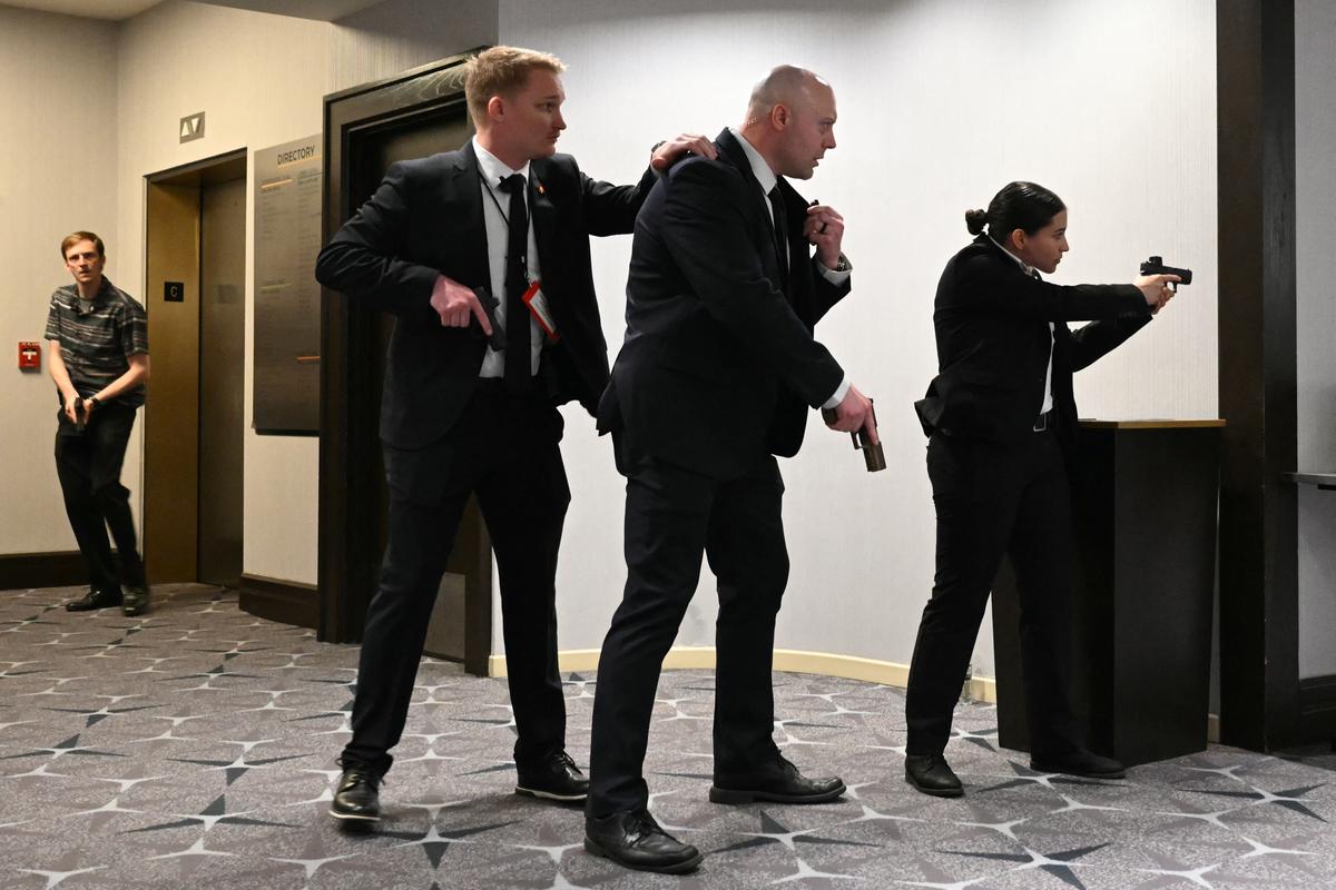  Agents drew their guns after loud bangs were heard during the White House Correspondents’ dinner at the Washington Hilton in Washington on April 25, 2026. 