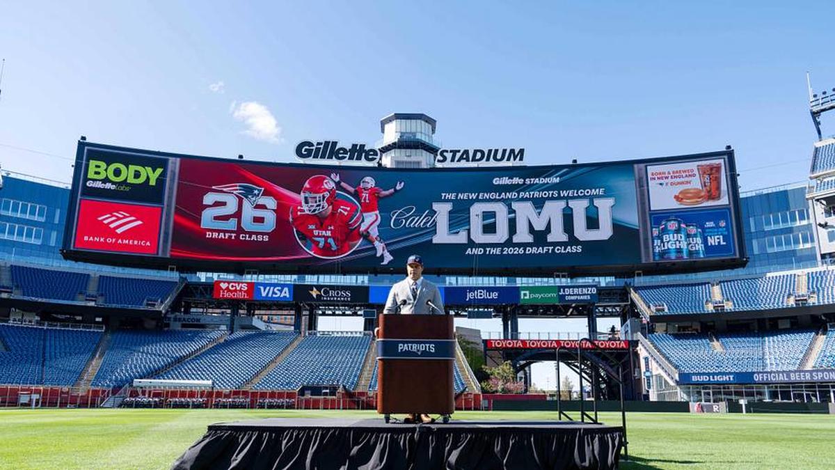  May 7, 2026; Foxborough, MA, USA; New England Patriots first round draft pick Caleb Lomu addresses the media during a press conference on the game field at Gillette Stadium. Mandatory Credit: Natalie Reid-Imagn Images | Natalie Reid-Imagn Images 