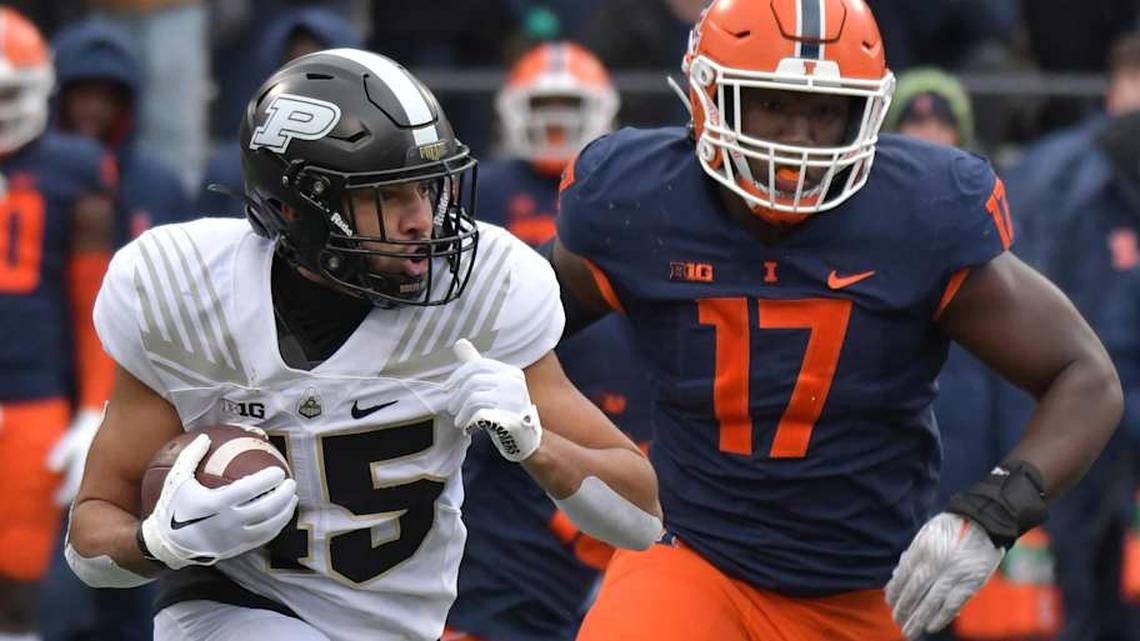  Nov 12, 2022; Champaign, Illinois, USA; Purdue Boilermakers running back Devin Mockobee (45) runs with the ball as Illinois Fighting Illini linebacker Gabe Jacas (17) pursues during the first half at Memorial Stadium. Mandatory Credit: Ron Johnson-Imagn Images | Ron Johnson-Imagn Images 
